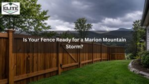 Backyard wood fence in Marion NC with dark storm clouds, wet grass, and strong fence posts before heavy rain